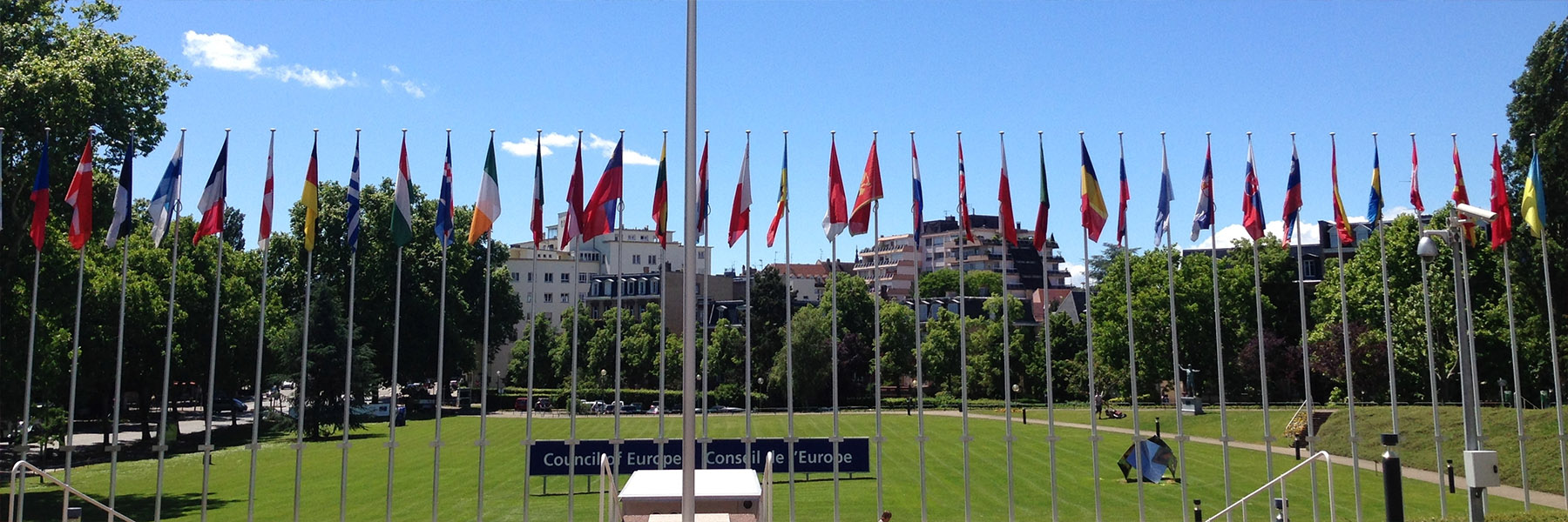 Landscape of a row of flags at a study abroad location.