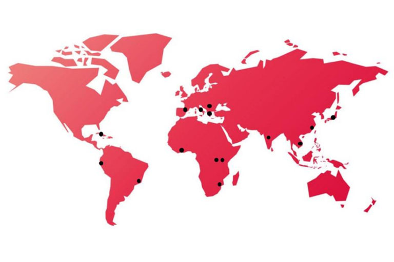 red stylized map of the world with points representing OVPDEMA Overseas' trips.